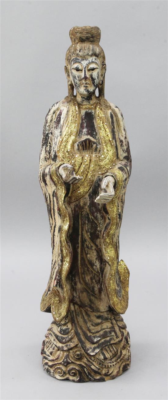 A Chinese carved standing figure of Kwan Yin, height 3ft 5in.